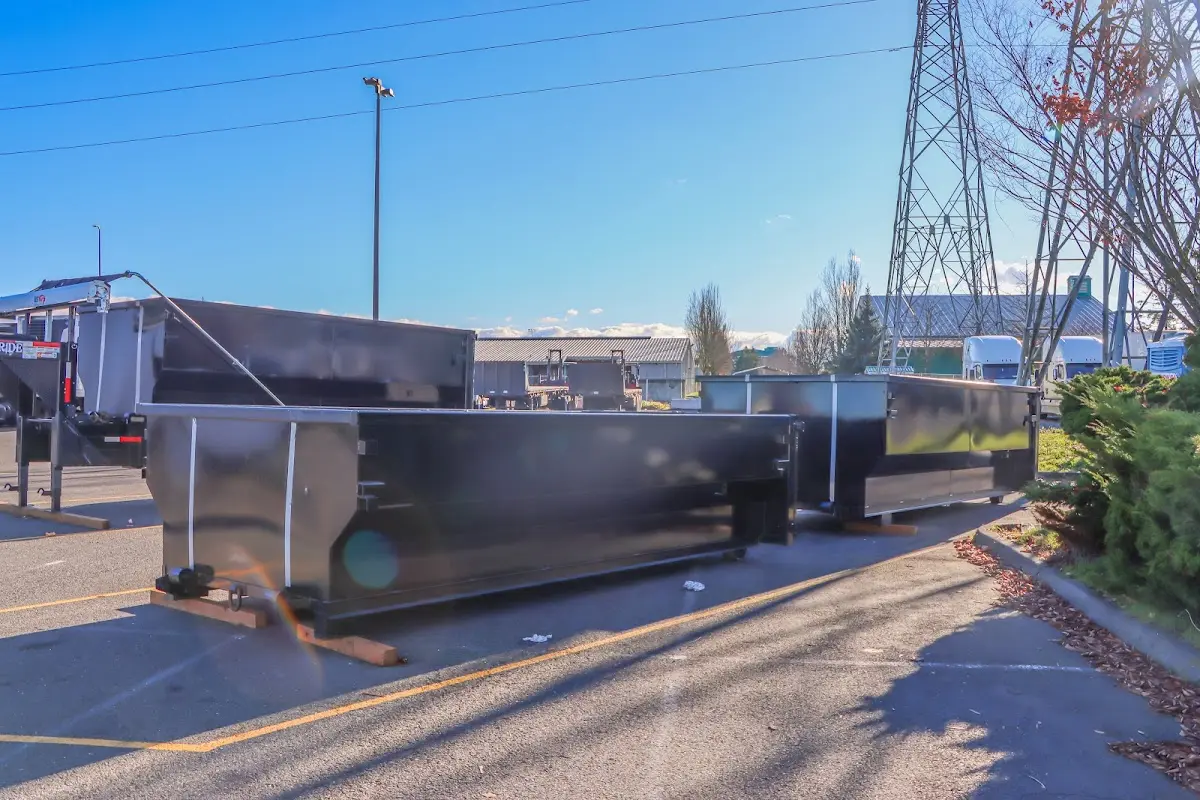 Roll-off dumpster ready for waste disposal at job site for Commercial Dumpster Rental in Flint